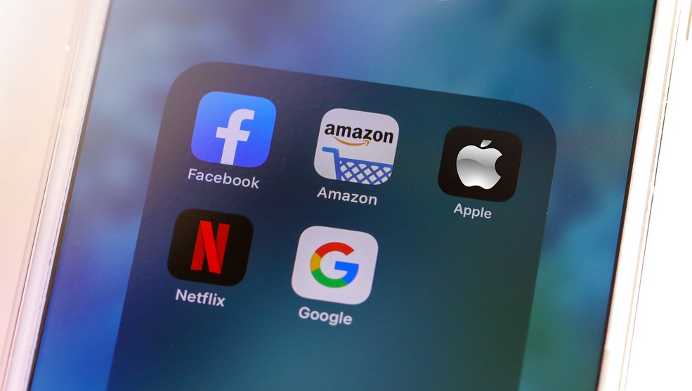 Big tech companies icons on phone screen