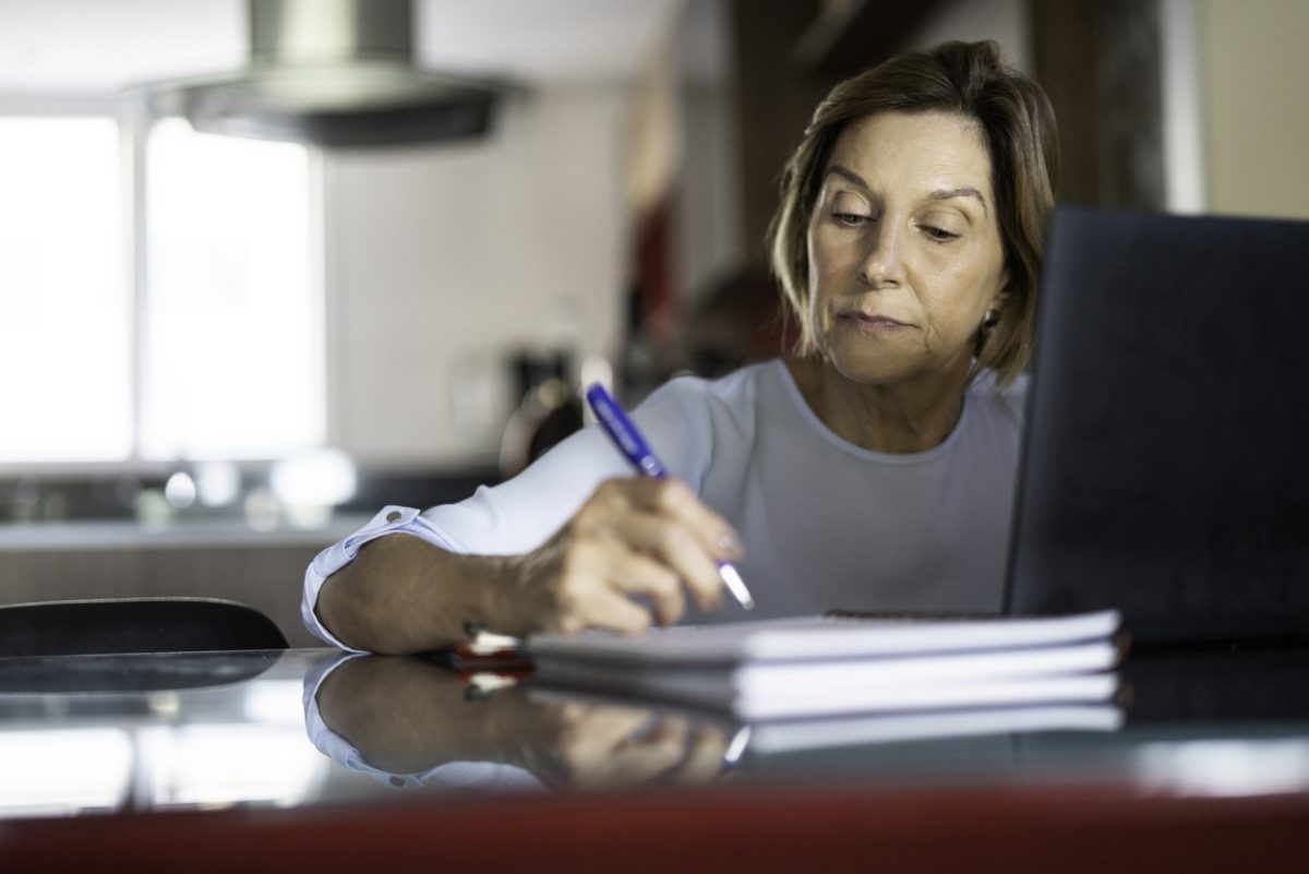 Mature woman writing a Will