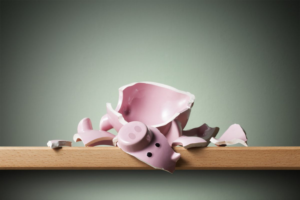 Broken piggy bank on the shelf. National Savings.