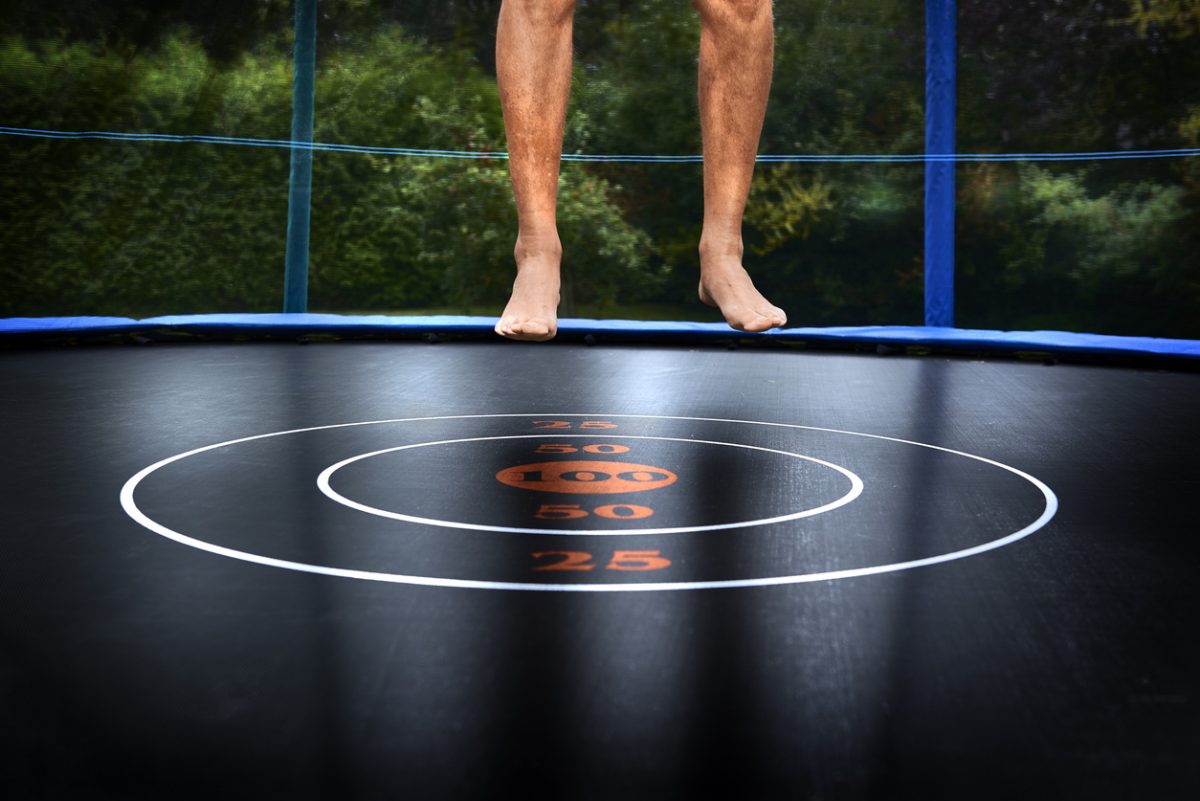 Man jumping on trampoline