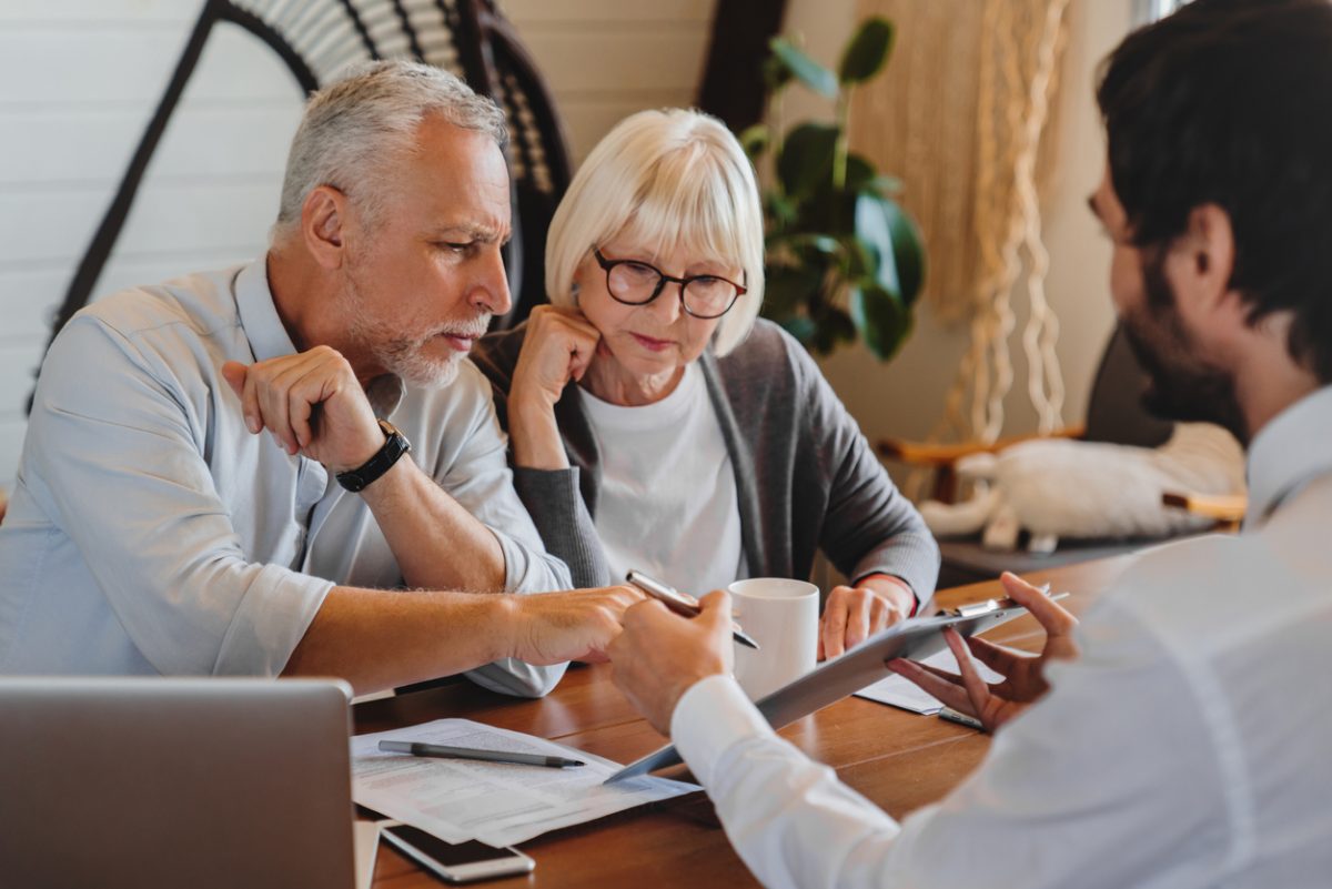 Senior couple receiving financial advice