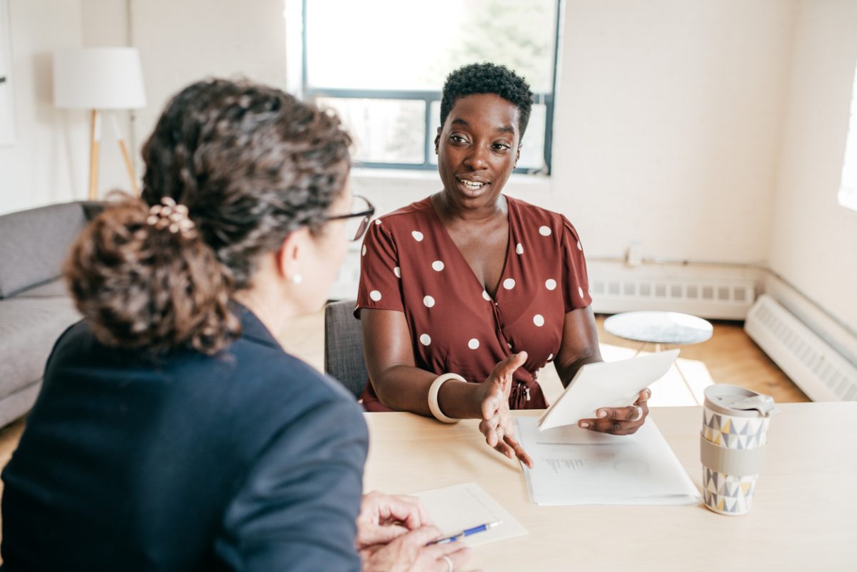 Woman speaking with her financial adviser