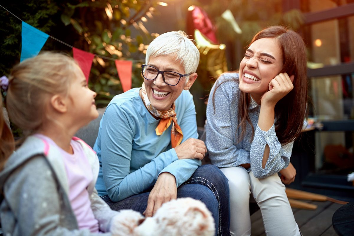 Grandmother, Mother, and Granddaughter sitting and chatting together