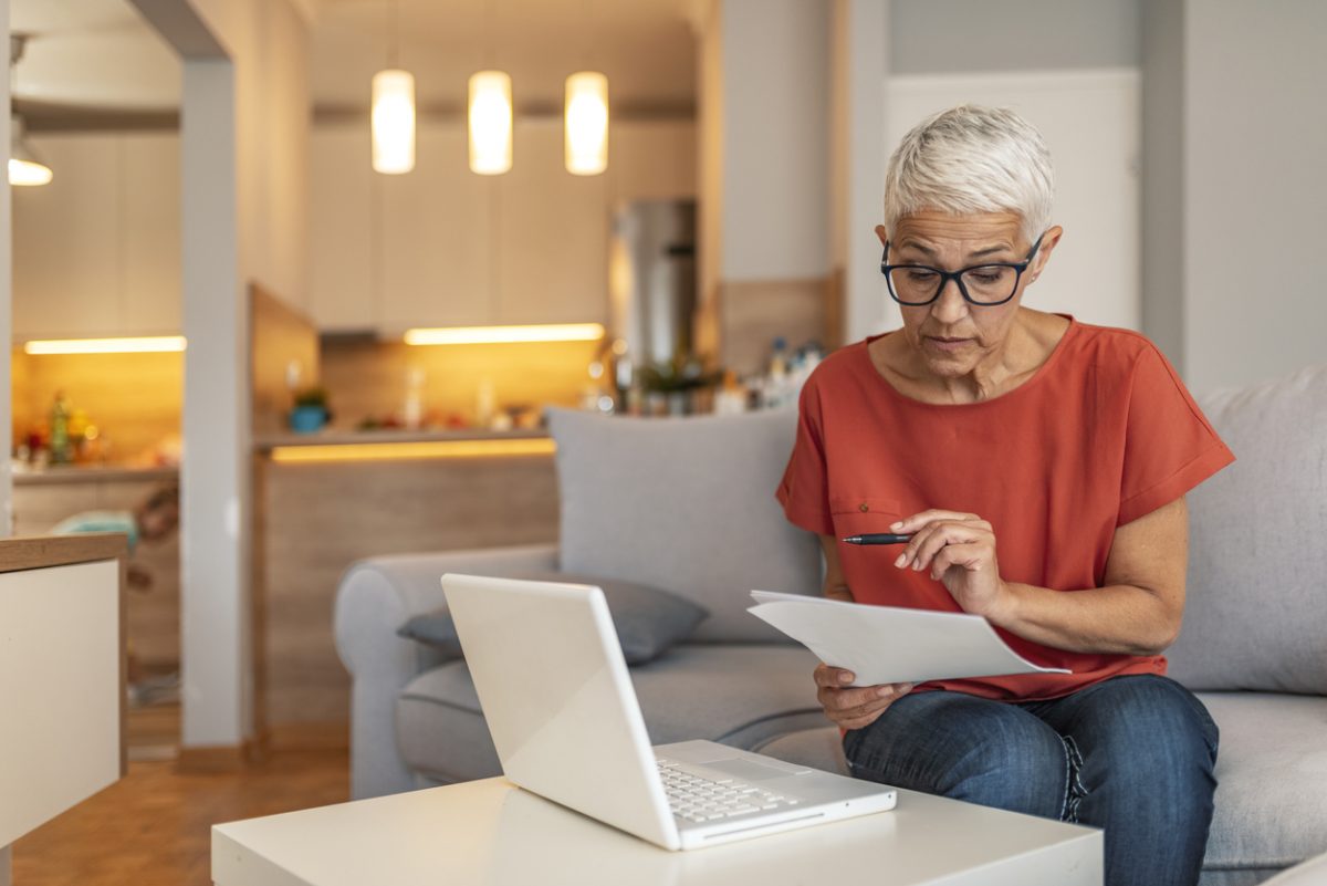 Woman at laptop reviewing tax allowances