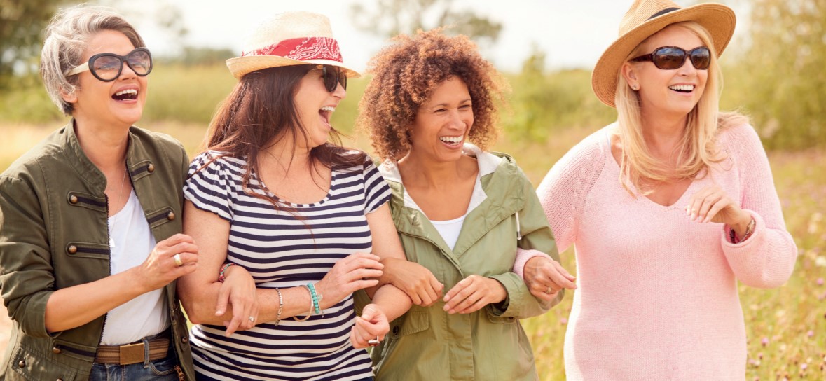 Group of middle aged women laughing together