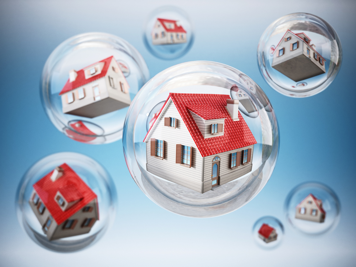 Houses in bubbles representing the UK housing market bubble