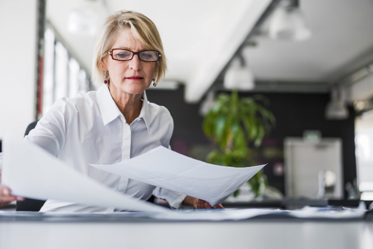 Mature woman reviewing her business finances