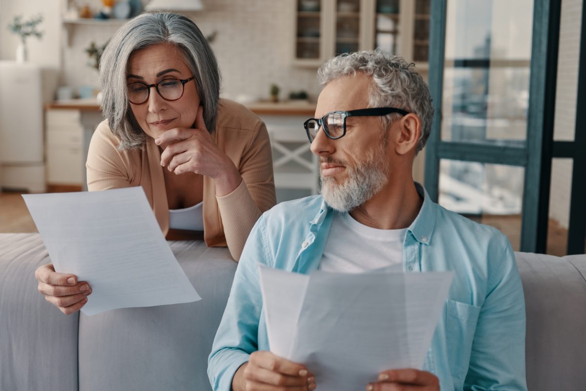 Mature couple reviewing finances together