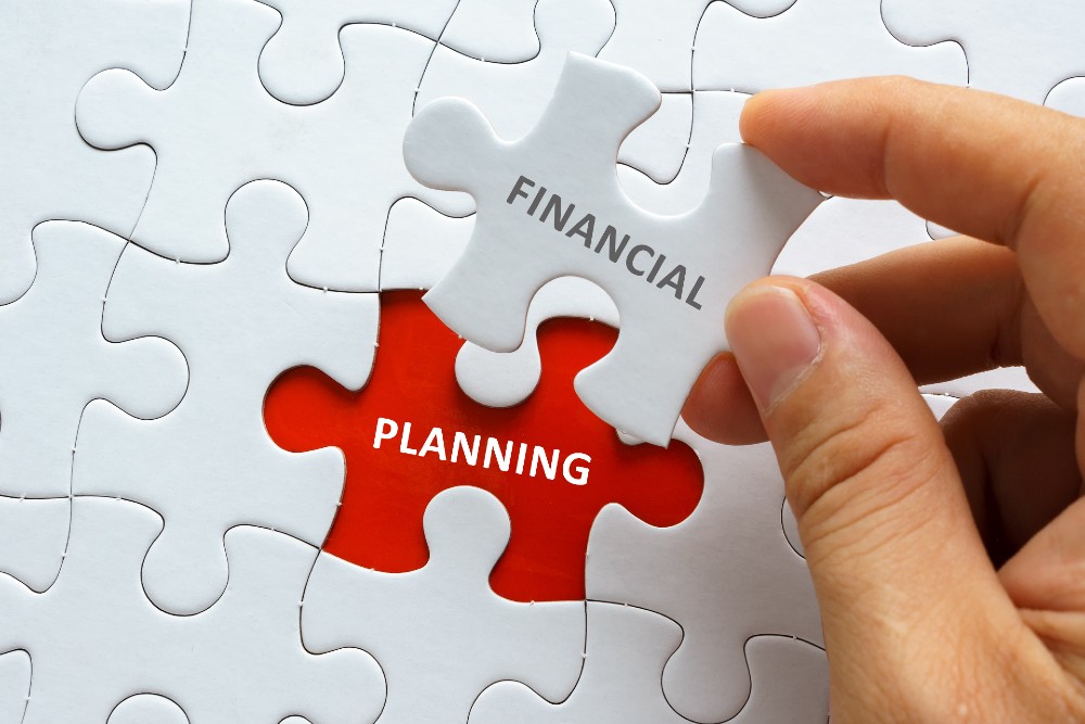 Jigsaw puzzle with pieces labelled 'Financial' and 'Planning'
