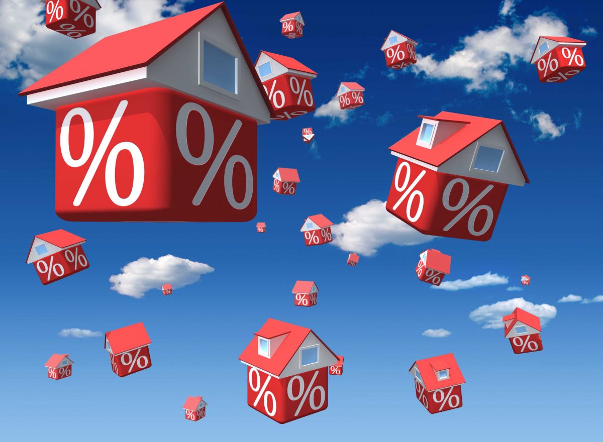 Graphic of houses falling through the sky with percentage signs on them representing falling house prices