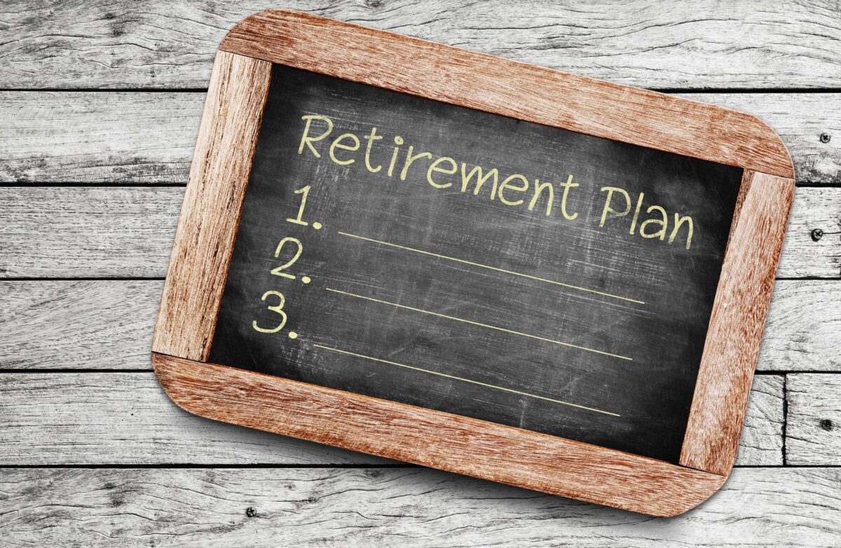 Graphic of a handheld blackboard with 'Retirement Plan' written on and points '1', '2', and '3'.